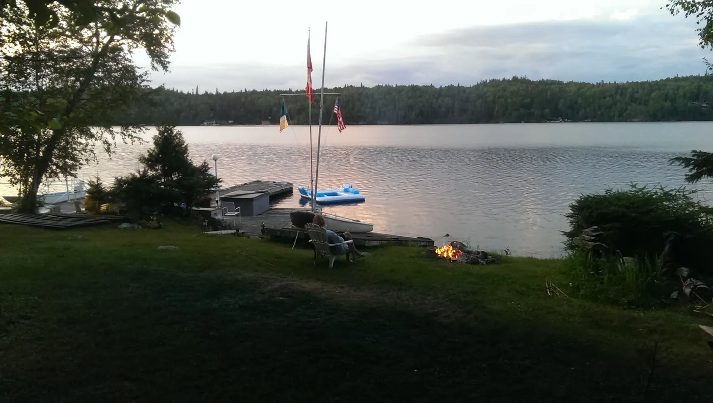 An earlier photograph of the shoreline at Woodchuck Bay, looking out across the water from the lawn.
