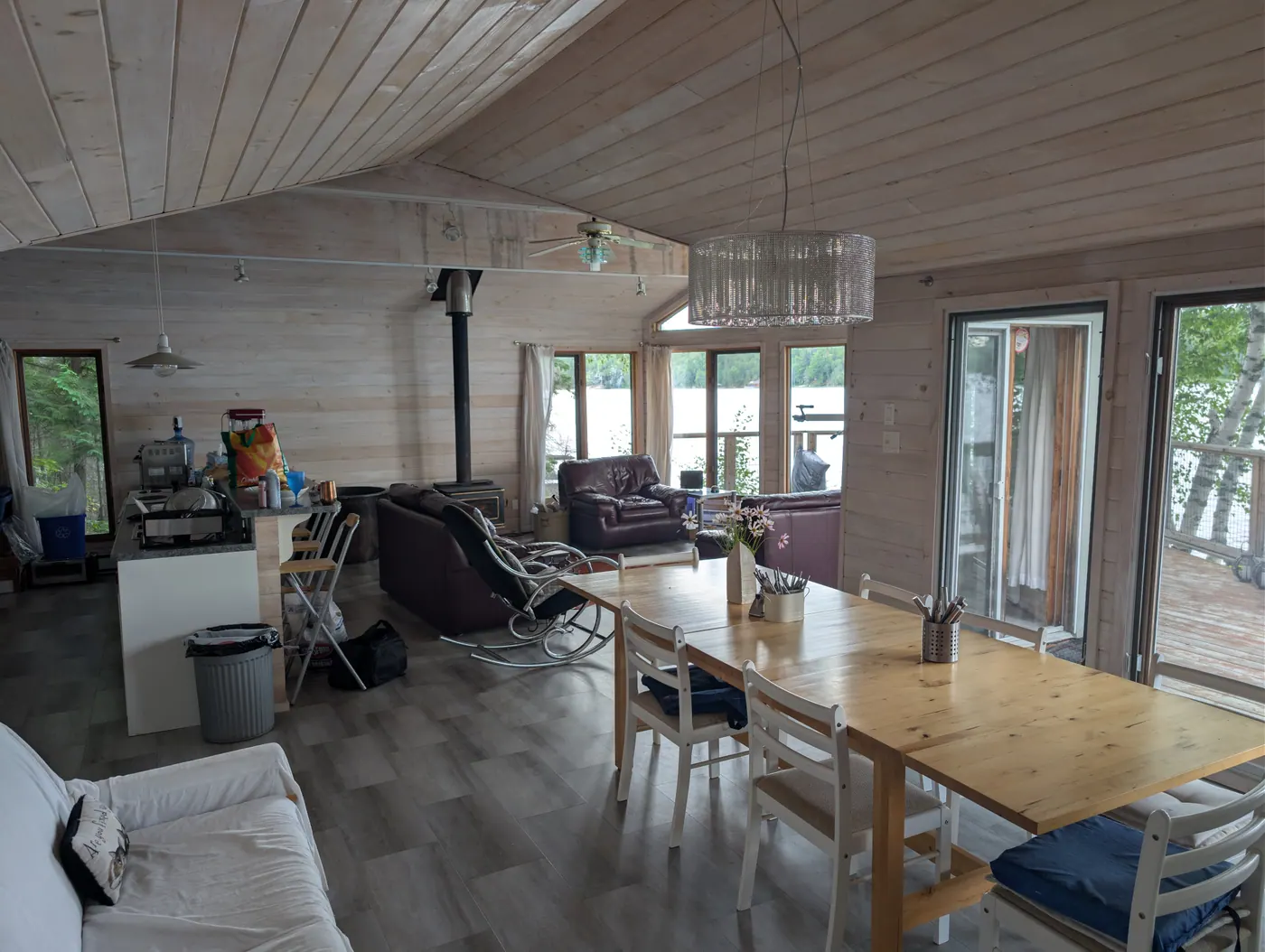 The kitchen and dining area, looking toward the windows and the lake.
