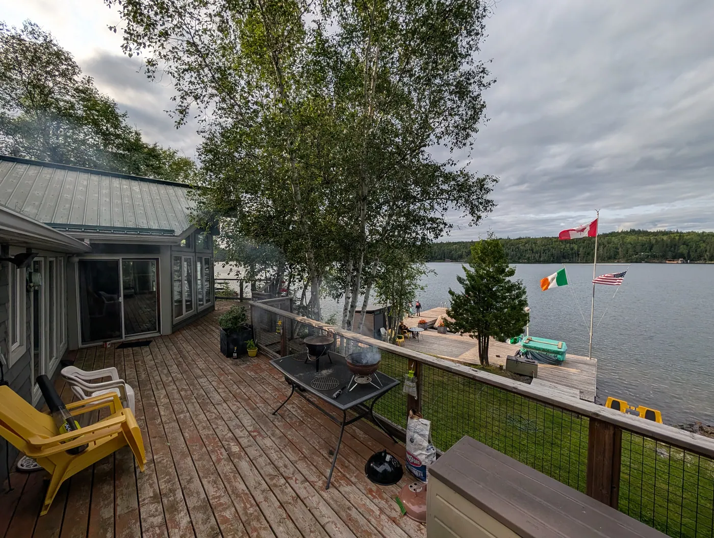 The lakeside deck with seating and the bay beyond.