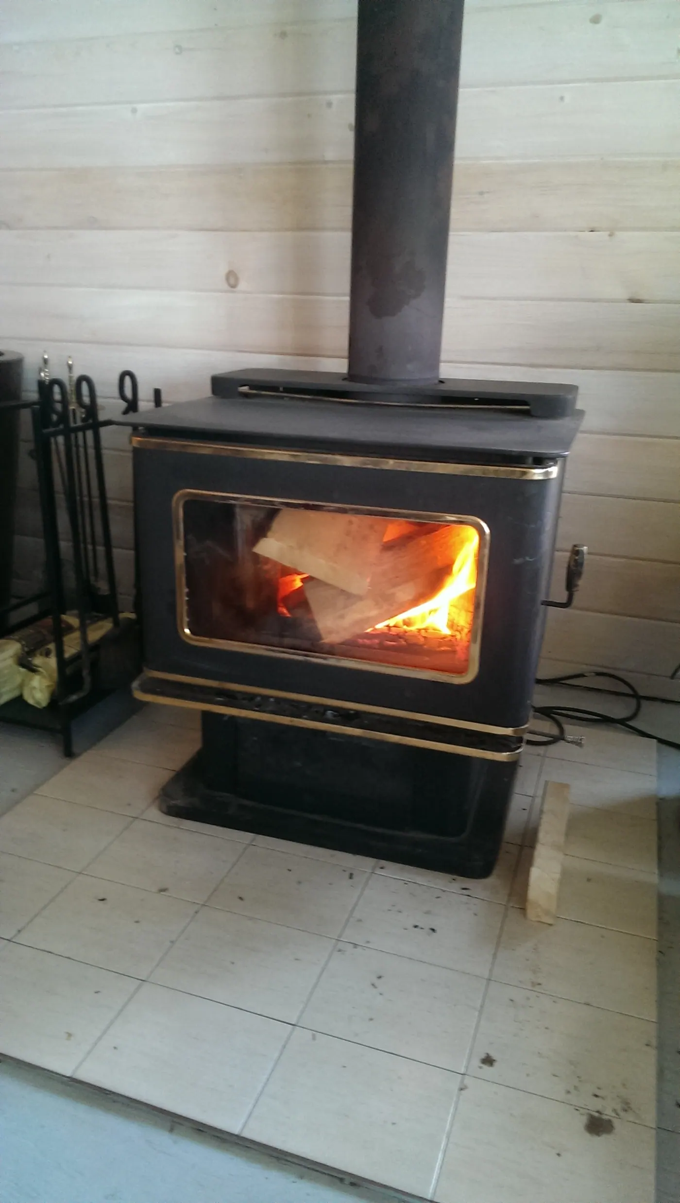 The wood stove lit on a cool evening.