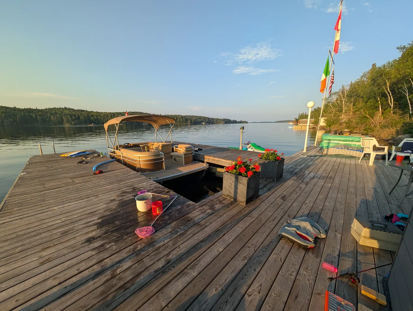 Chairs and flags on the dock in the evening.